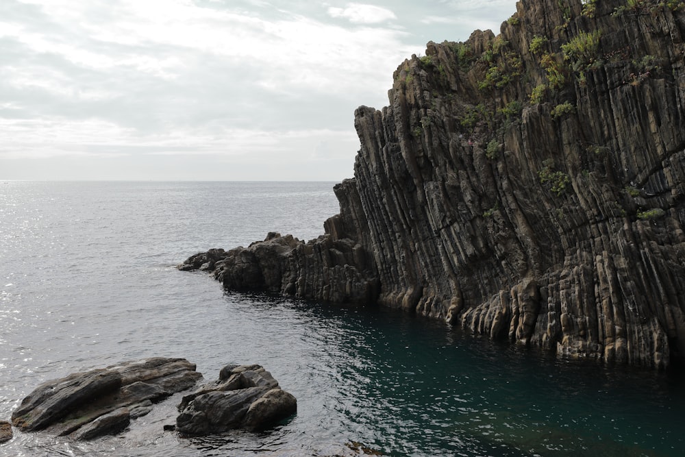 gray stone surrounded by water