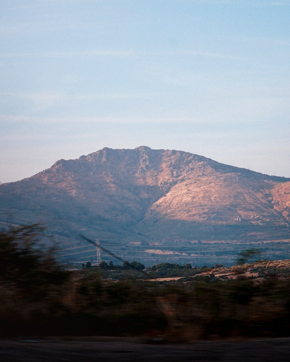 brown mountain under blue sky