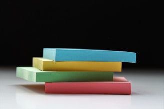 four assorted-color sticky notes