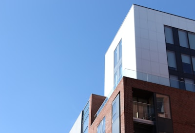 Modern building exterior with clear sky in the background.