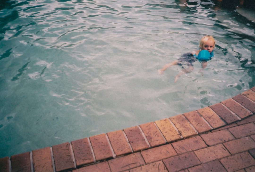 girl swimming on pool