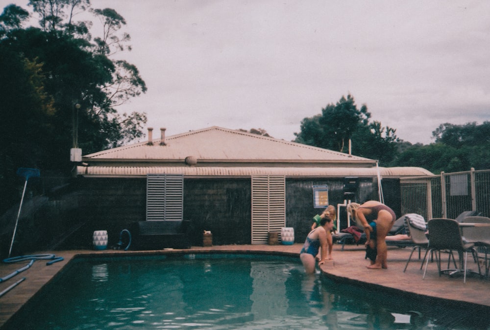 people near pool during daytime