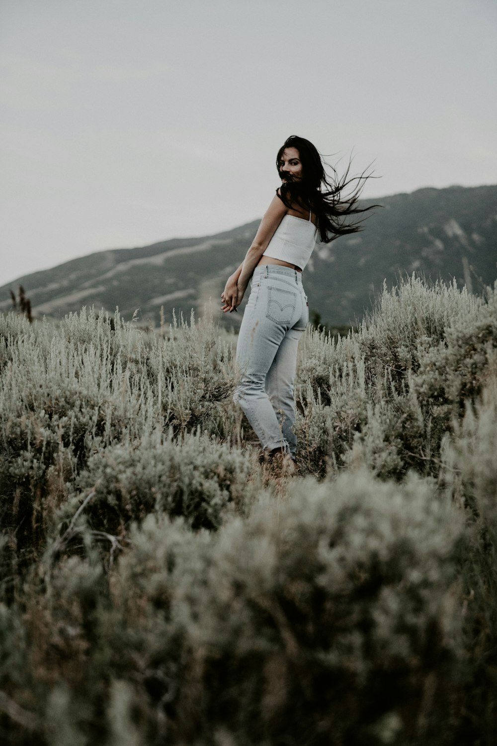 woman standing on grass during day