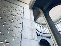 Interior view of a finished barndominium showcasing polished concrete floors and bright steel beams.