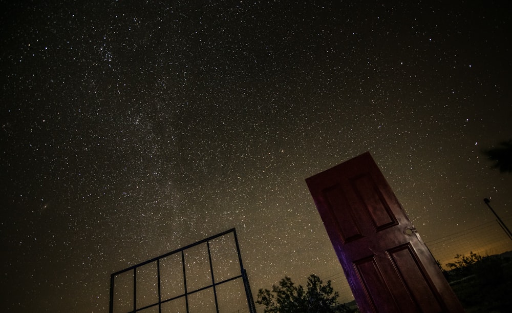 brown wooden door at nighttime
