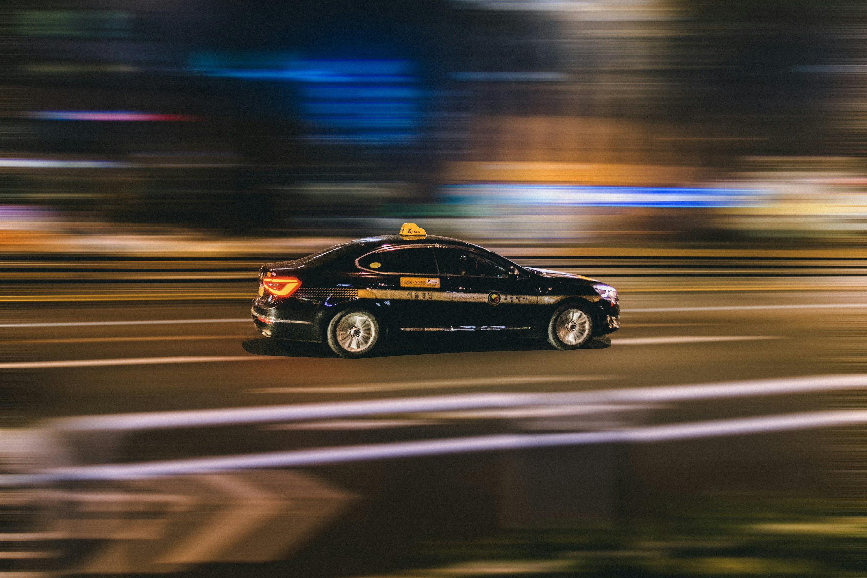 timelapse photography of black vehicle at night