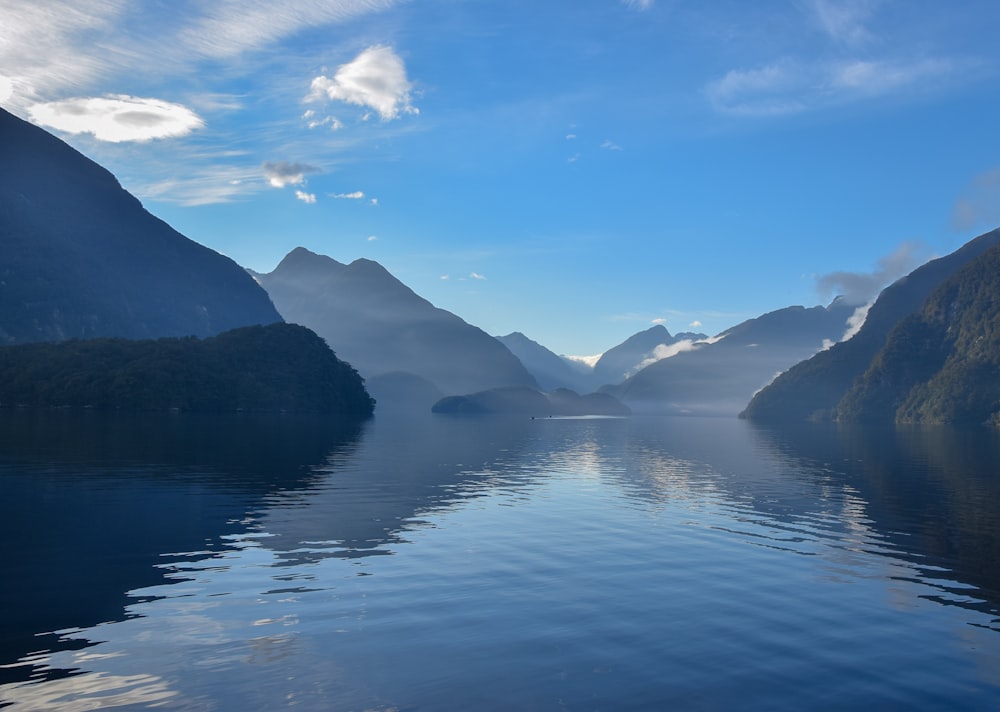 lake and mountains during day