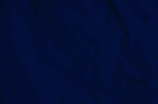 Close-up of a textured monotype print with rich layers of ink and subtle color variations.