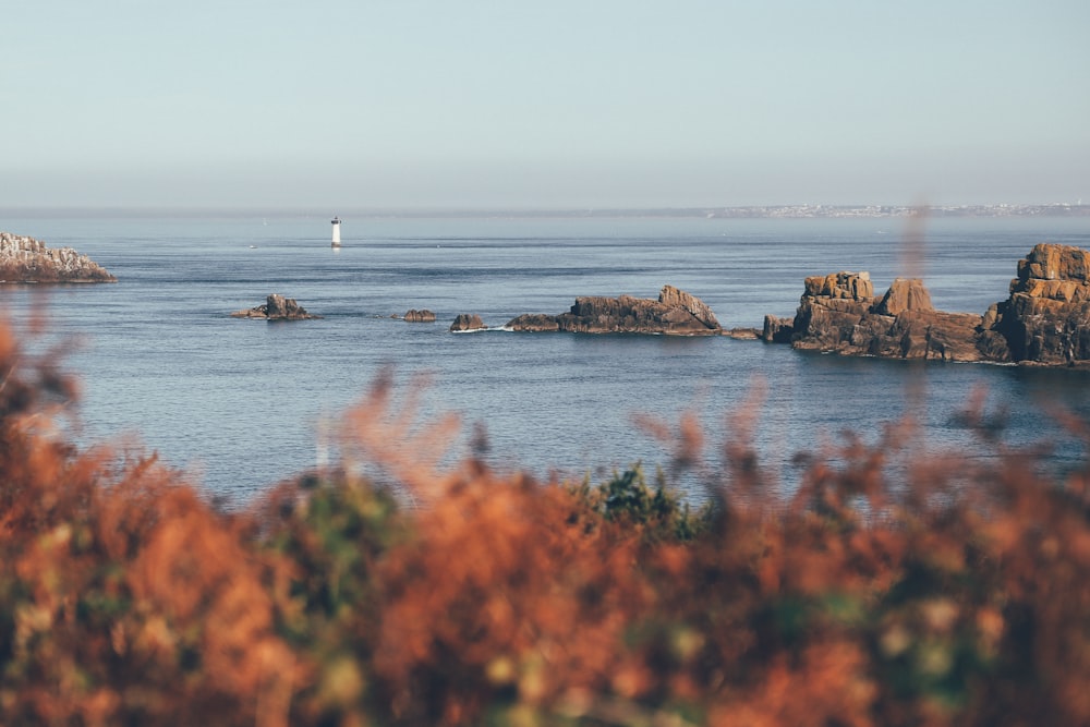 body of water under blue sky