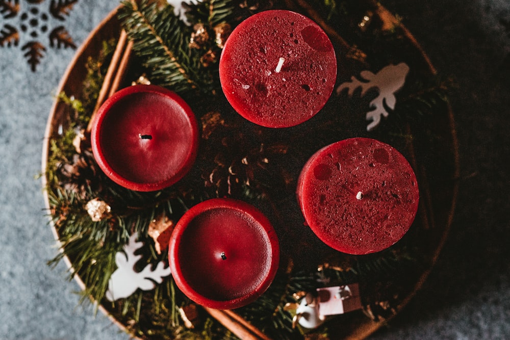 four red pillar candles