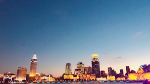 Evening skyline with glowing lights highlighting the city’s geography