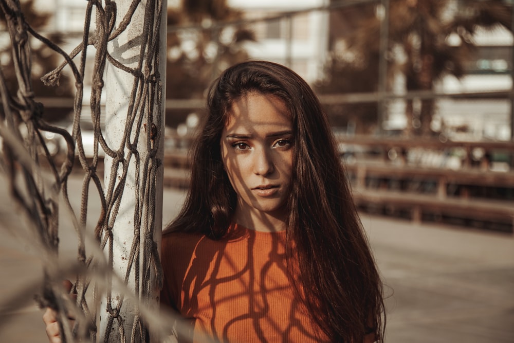 woman weairng orange top