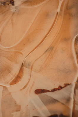 A maroon and gray abstract pattern with subtle brown accents.