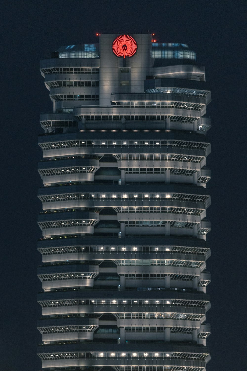 lighted grey concrete building at night