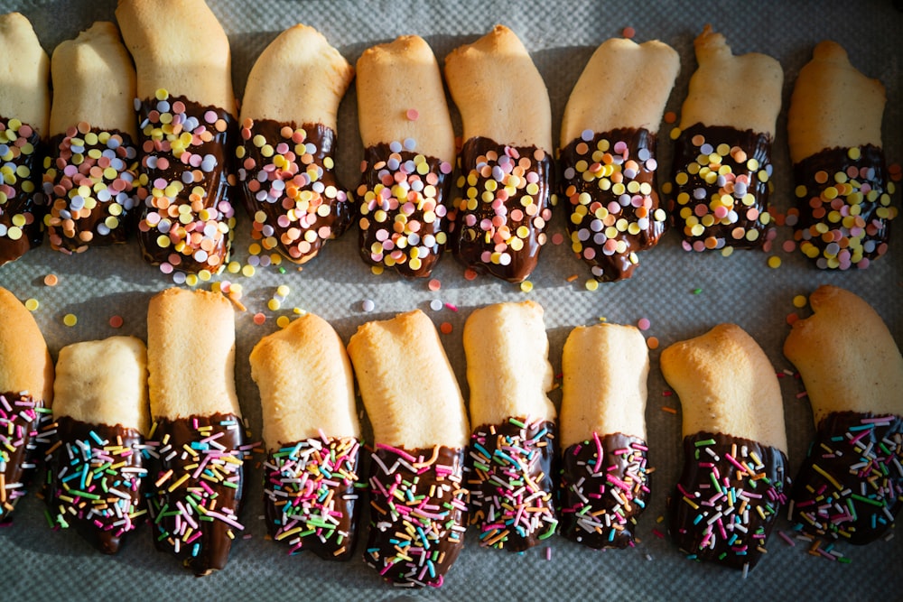 chocolate coated pastries with sprinkles