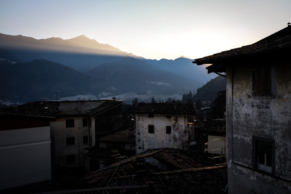 gray concrete buildings near mountains