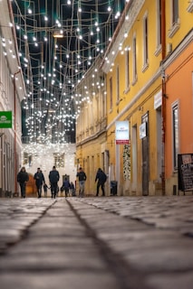 A group of friends exploring colorful streets in a charming foreign town.