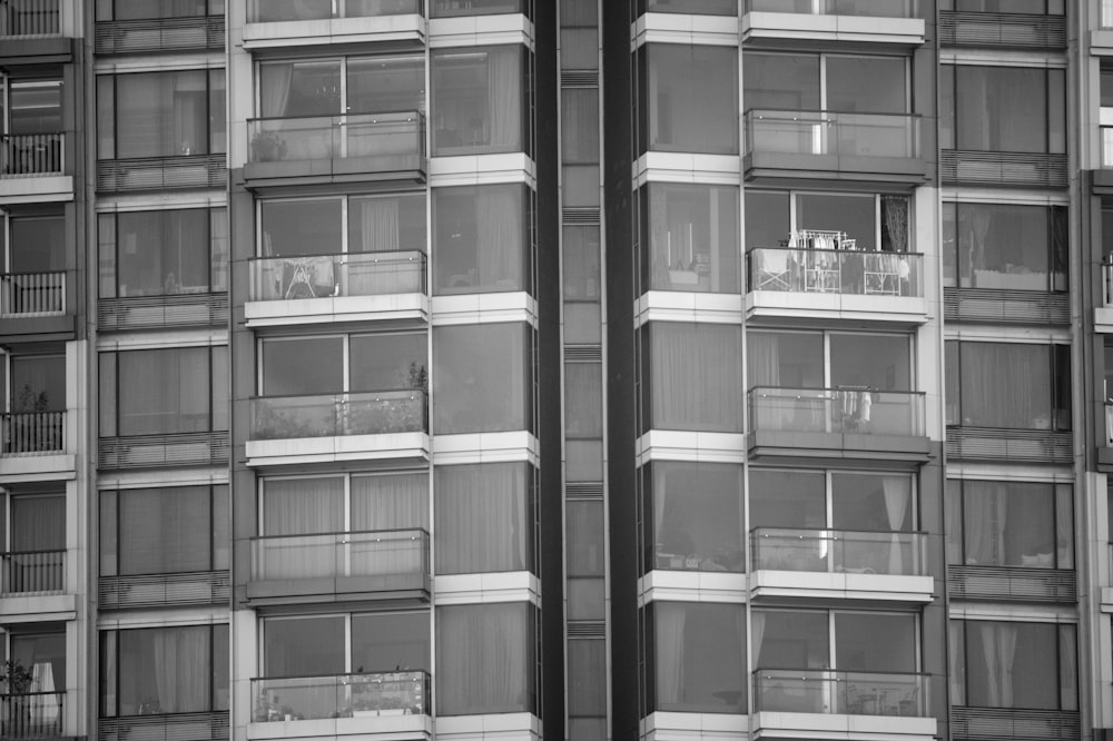 grayscale photography of curtain building