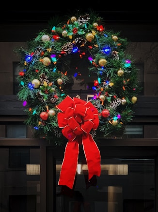 red and green Christmas wreath with baubles