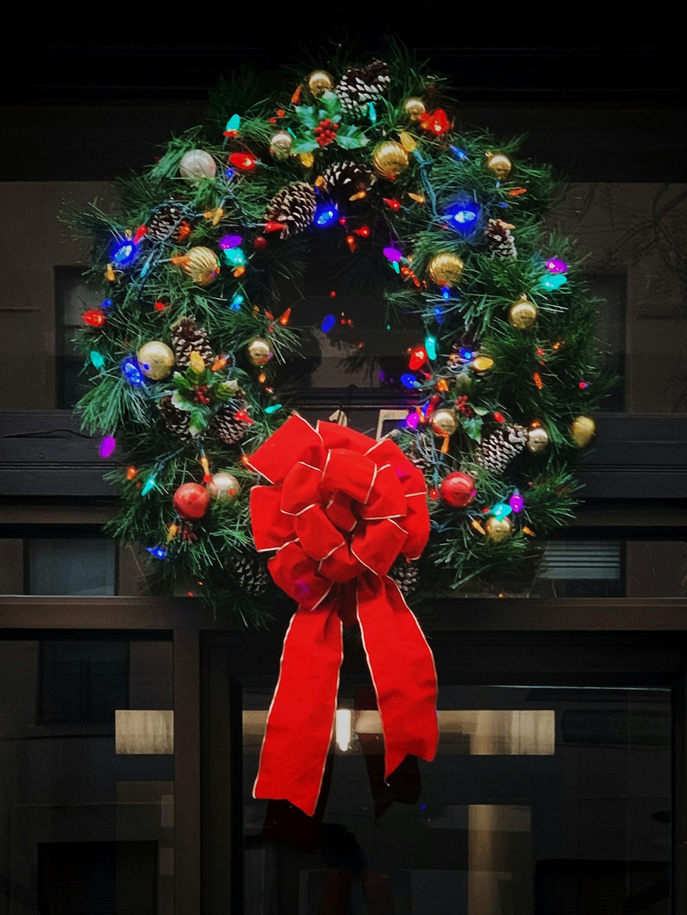 red and green Christmas wreath with baubles