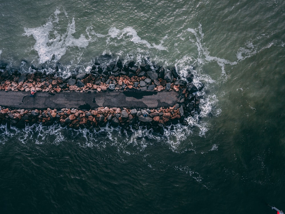 aerial photography of dock in middle of body of water during daytime