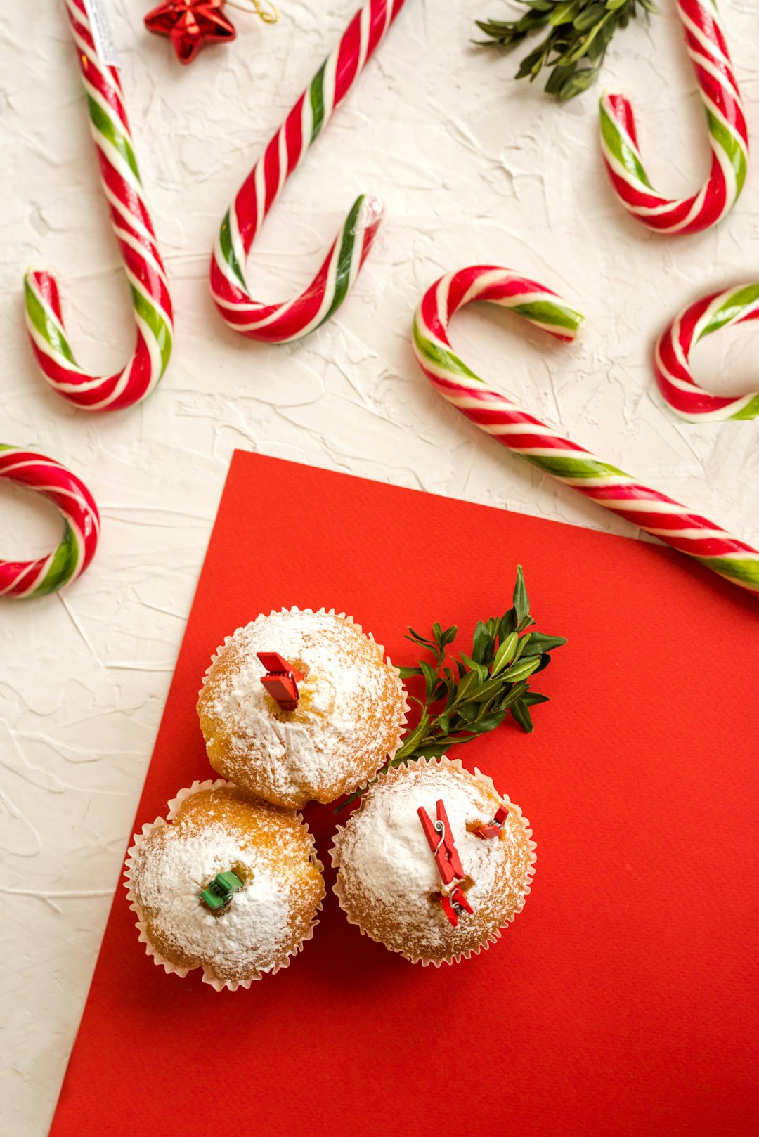 three cupcakes on red paper