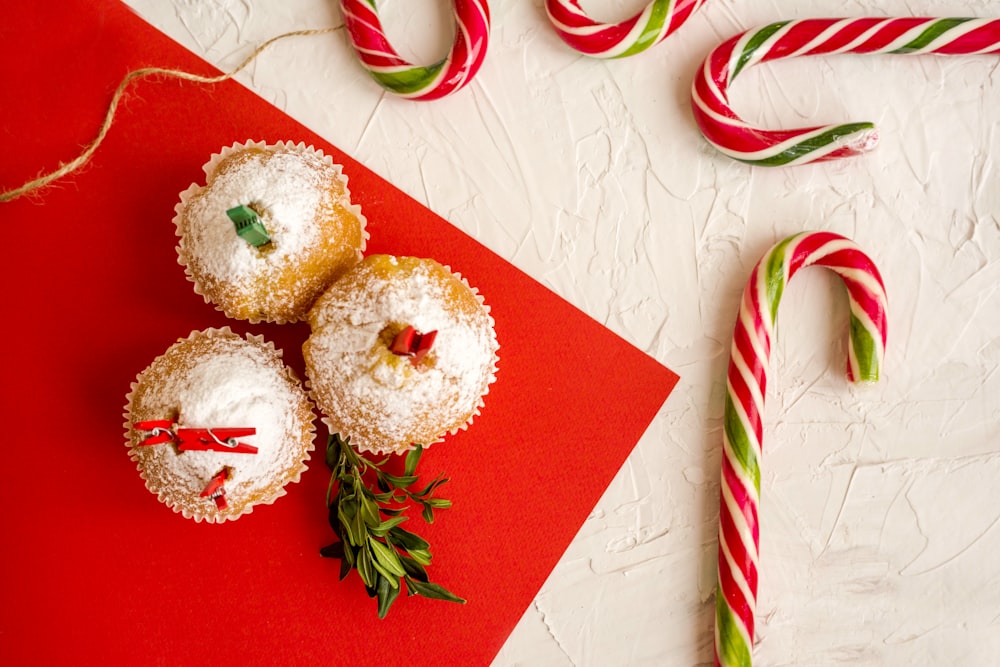 cupcakes beside candy canes