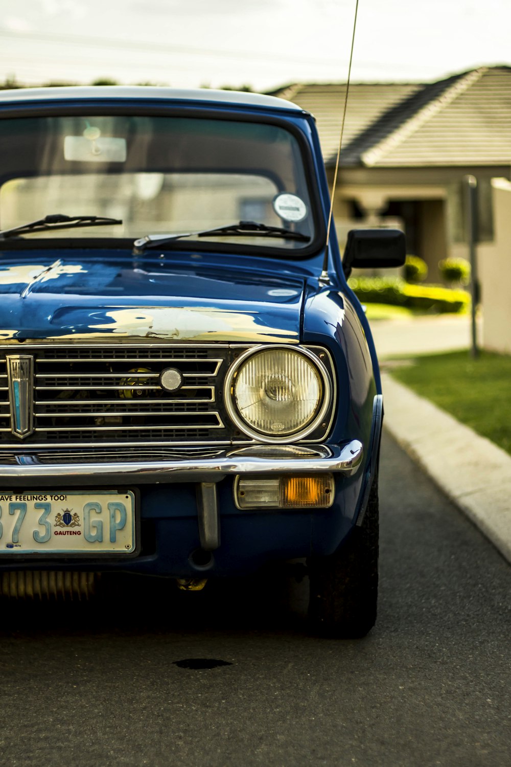 blue vehicle on road