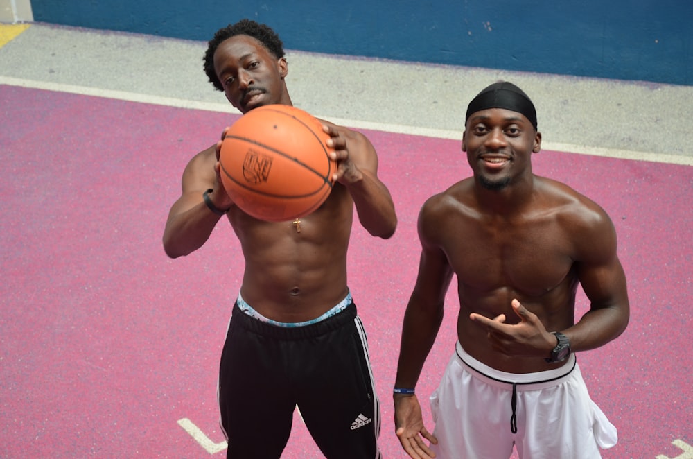 topless men playing basketball