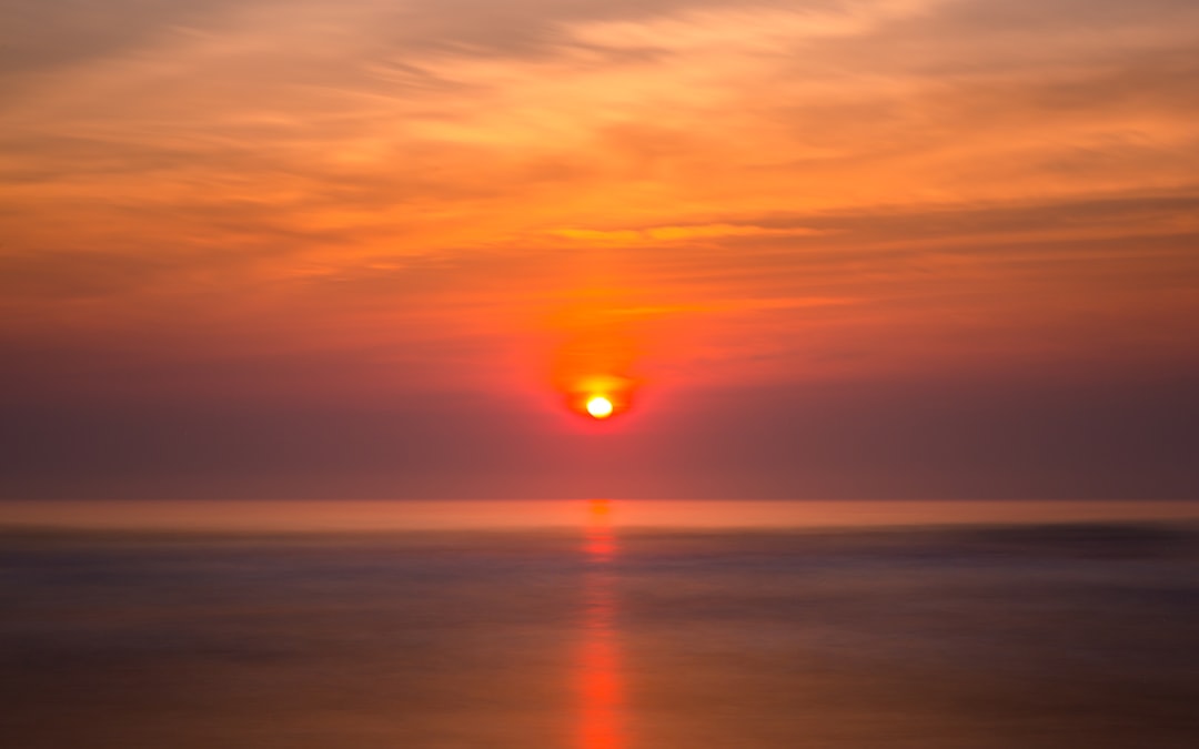 calm body of water during golden hour