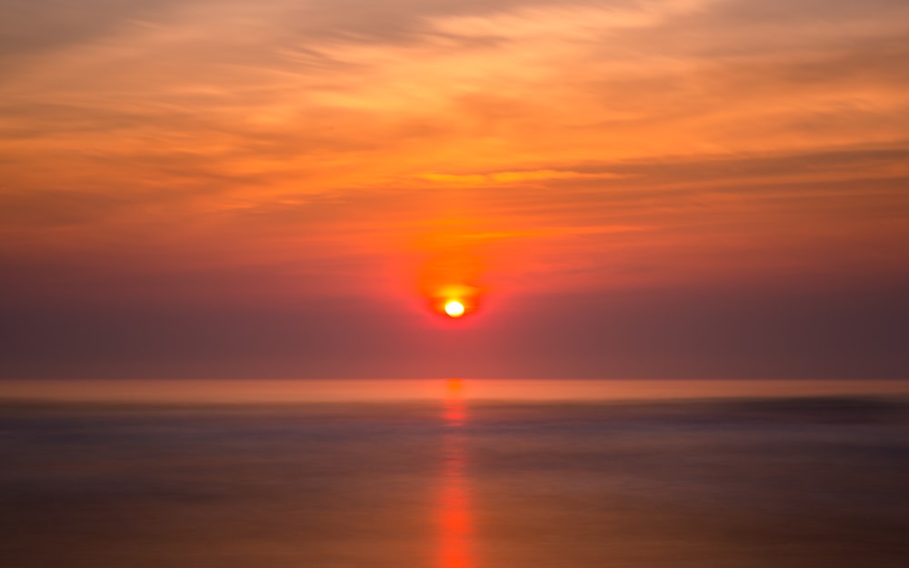 calm body of water during golden hour