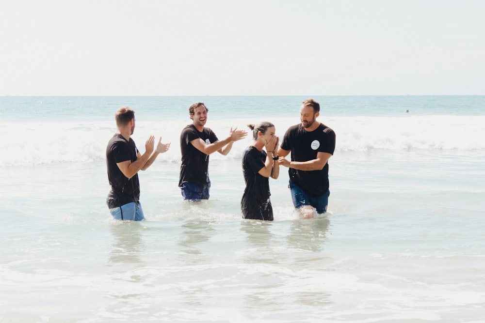 men standing in body of water