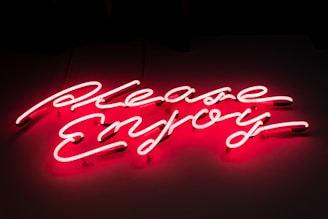 A vibrant photo with the word 'pleasher' elegantly superimposed in bold, artistic lettering.