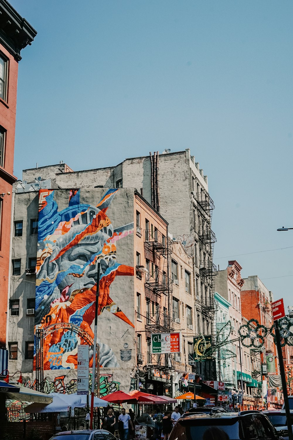 grey concrete buildings with graffiti during daytime