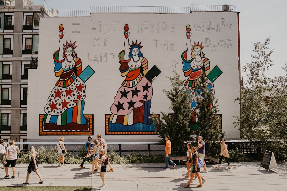 people walking near billboard