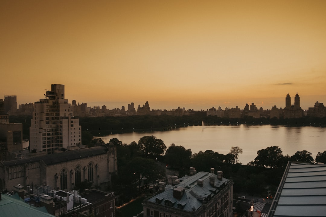 panoramic photography of city by body of water during golden hour