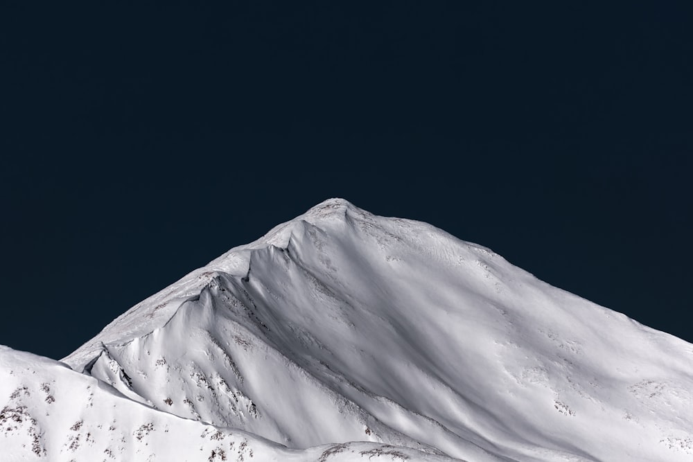 a snowboarder is doing a trick in the air