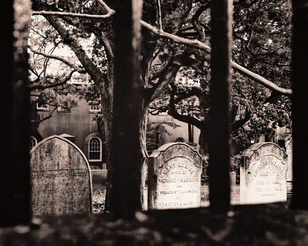 grayscale photo of tombstones