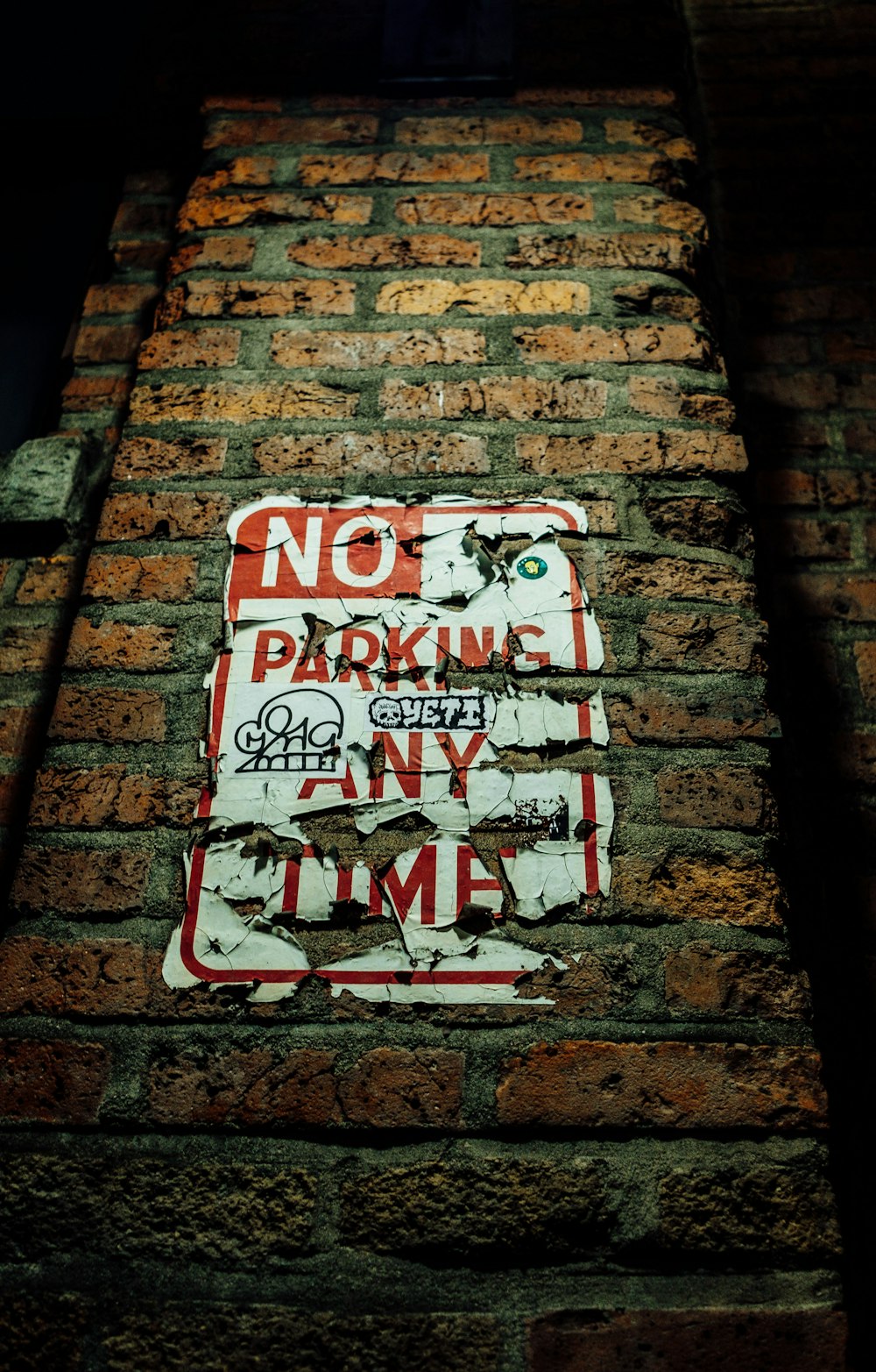 No Parking Any Time sign on wall