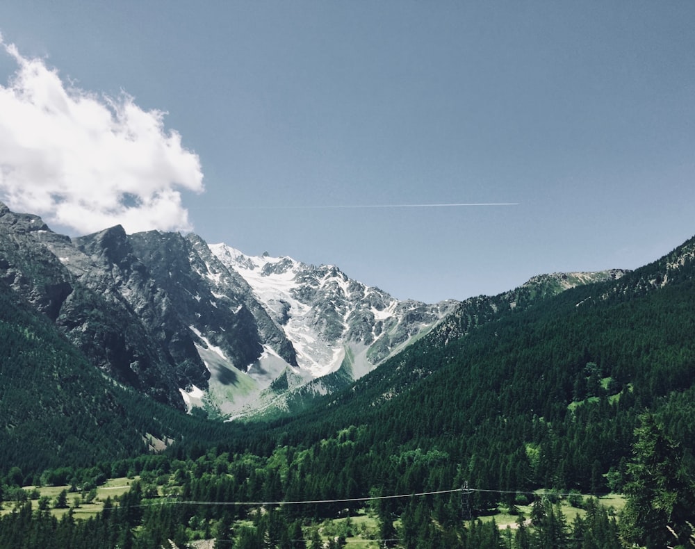 mountain under white skies view