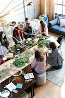 woman sitting on chair holding leaf