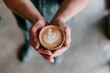 person holding coffee cup