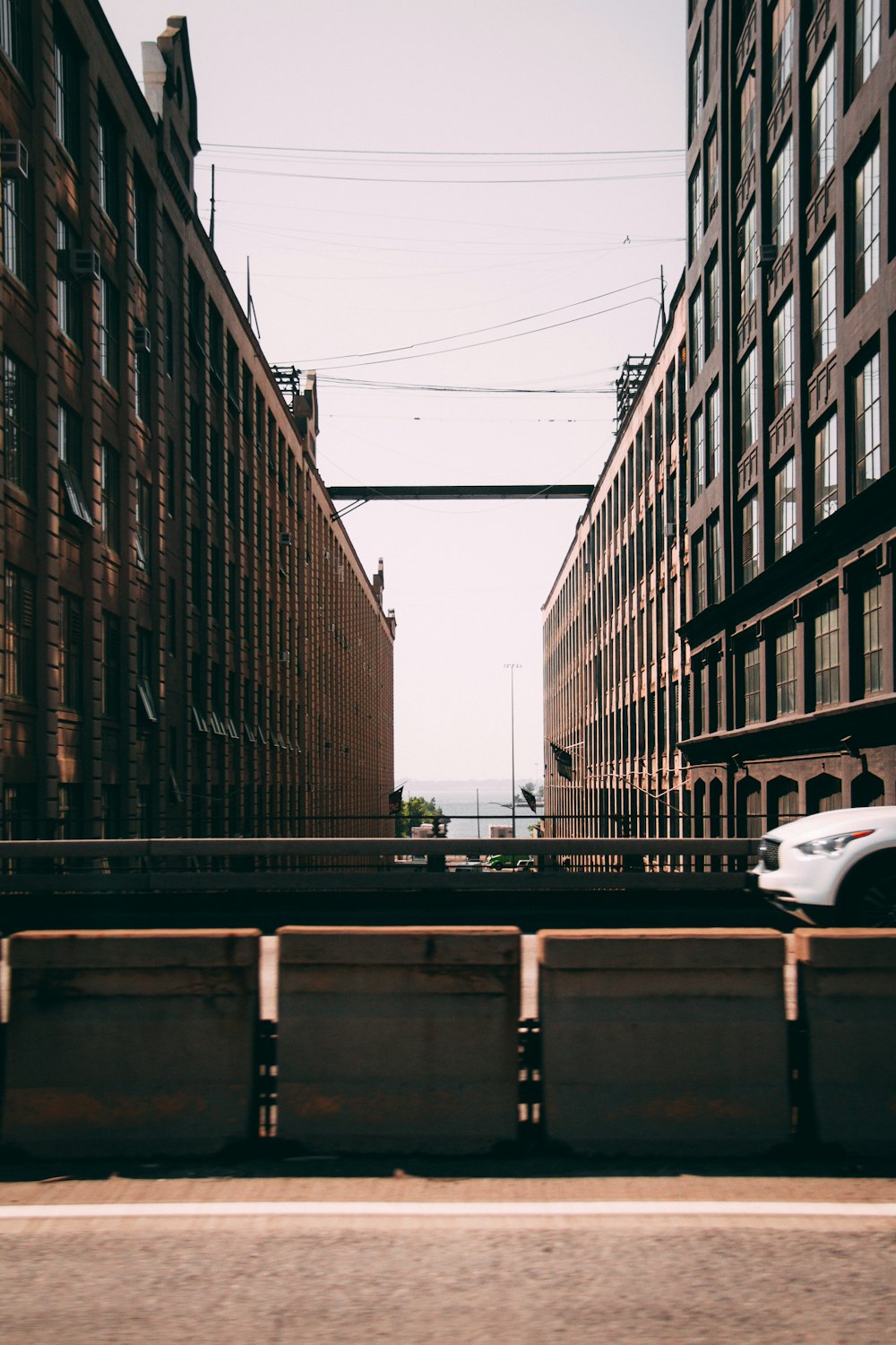 empty road between building during daytime