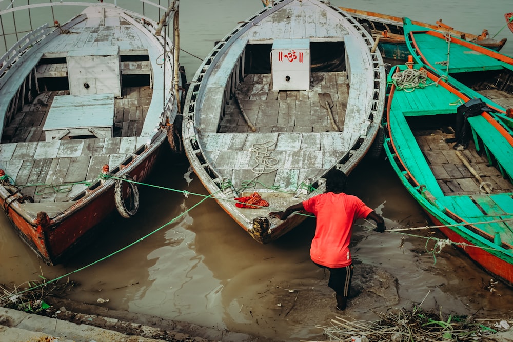 person holding white boat