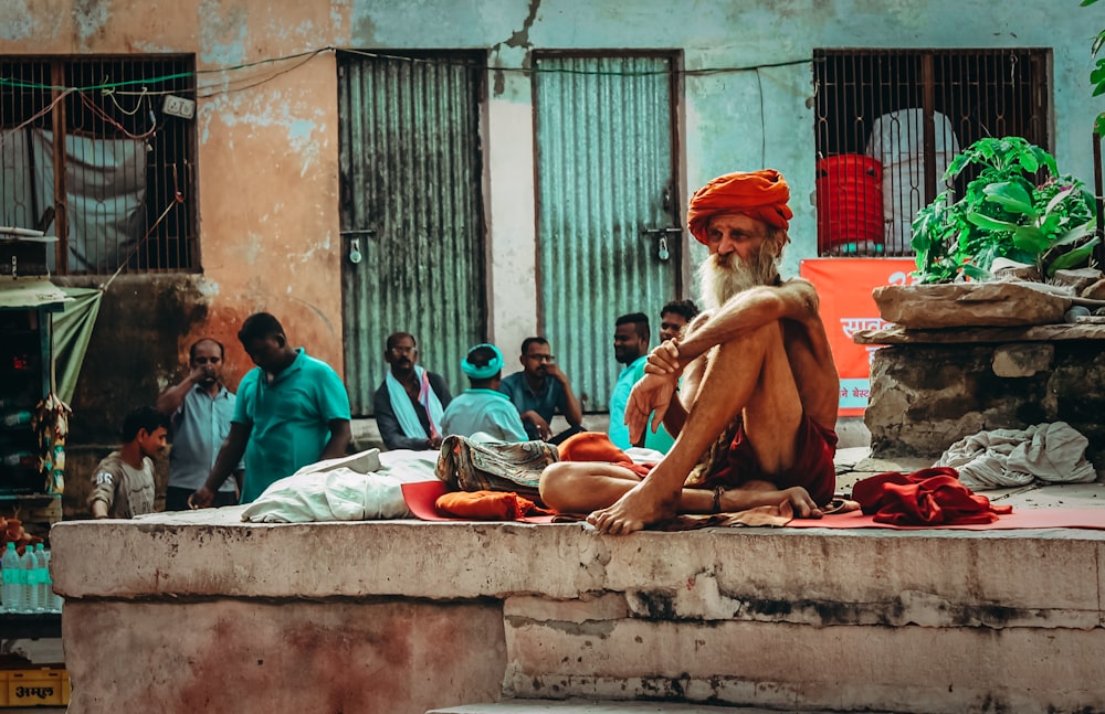 man sitting on stage