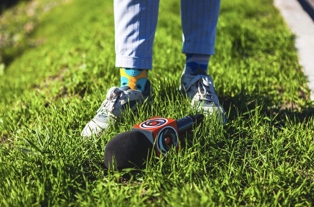 microphone on grass beside person's feet