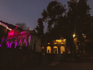 Evening lights illuminating the holy sites, creating a calm atmosphere.