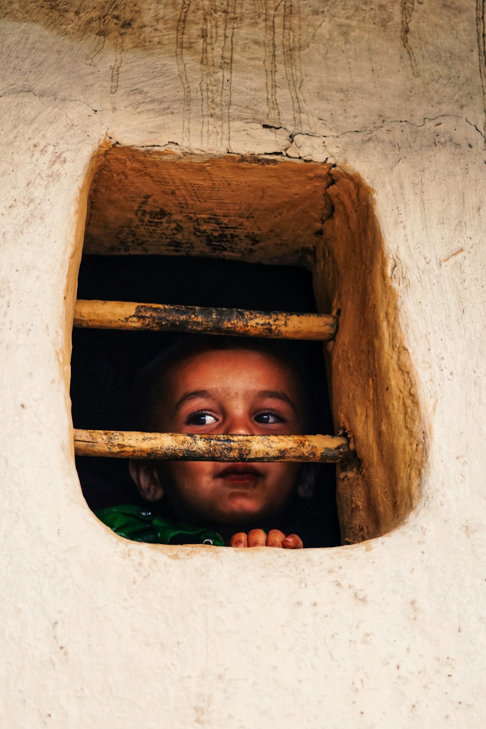 girl standing near window during daytime