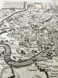 An ancient silk road map overlayed with modern travel routes and historical landmarks.