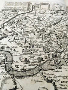 An ancient map with historical landmarks and artifacts scattered around.